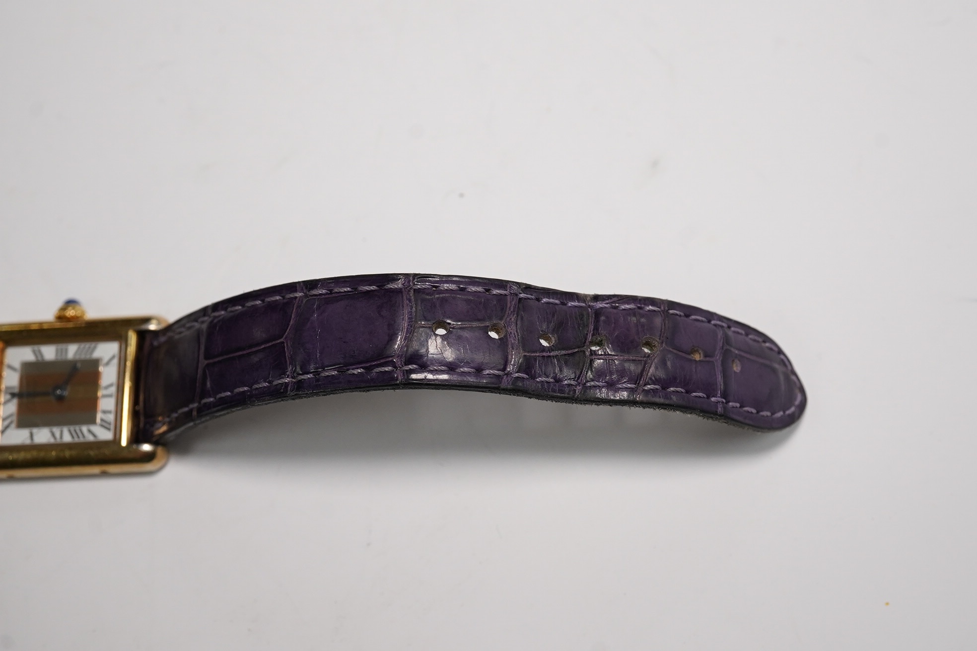 A lady's Cartier Vermeil Tank gilt 925 quartz wrist watch, with cabochon sapphire set crown and Cartier leather strap, cased diameter 20mm, no box or papers. Condition - poor to fair